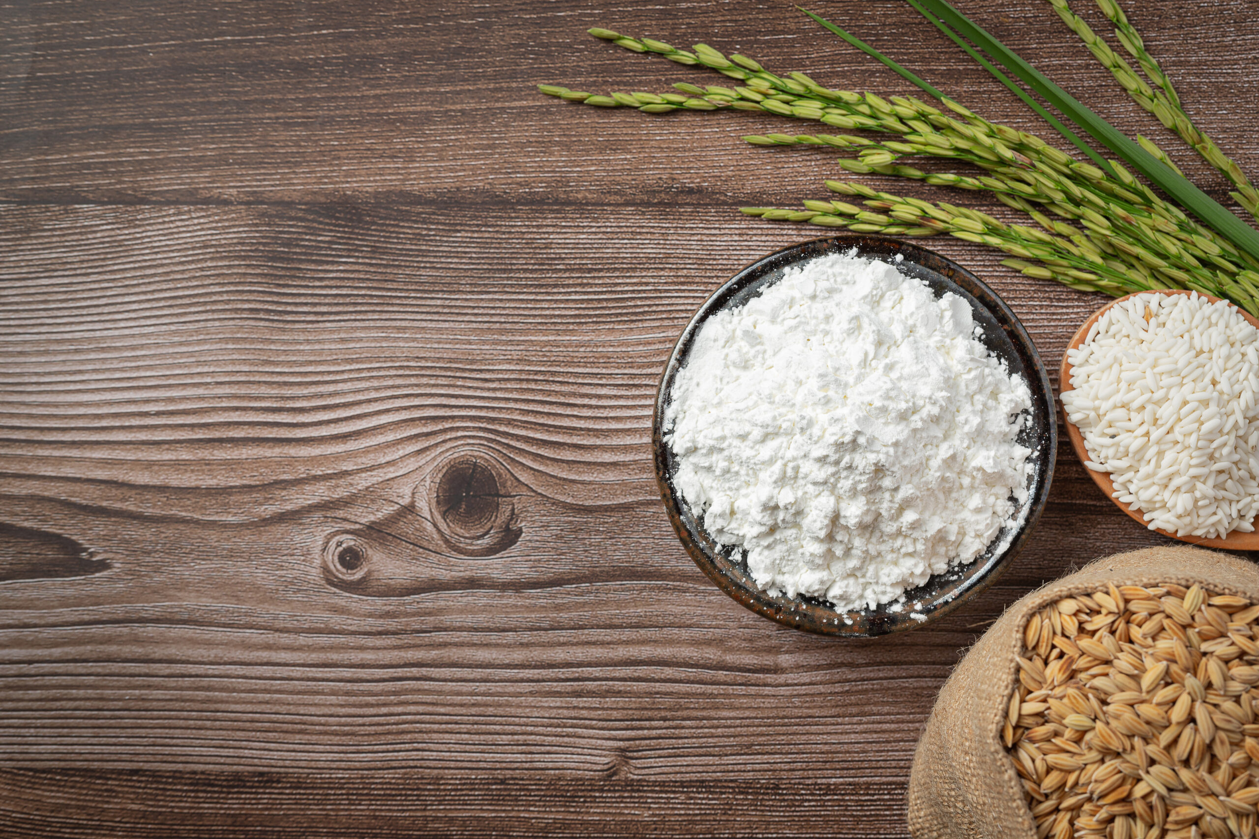 top view of various kinds of produce from rice place on wooden f